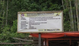 papan proyek pekerjaan jaringan irigasi Taluditi oleh CV. Molosipat Jaya