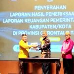 Ketua DPRD Beni Nento Dampingi Bupati Saipul Mbuinga Terima LHP Dari BPK RI Perwakilan Provinsi Gorontalo