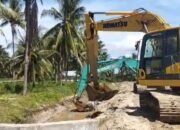 Proses normalisasi dengan menggunakan alat berat