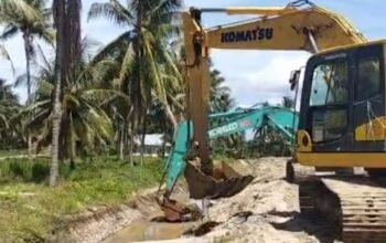 Proses normalisasi dengan menggunakan alat berat